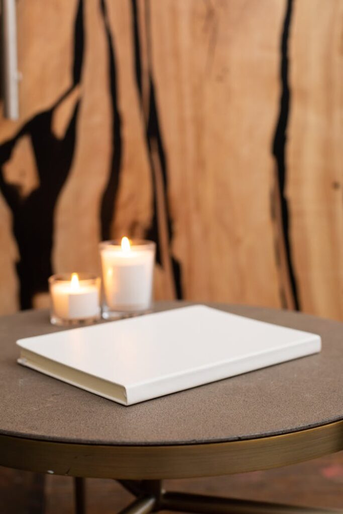 Blank notepad on table with candles